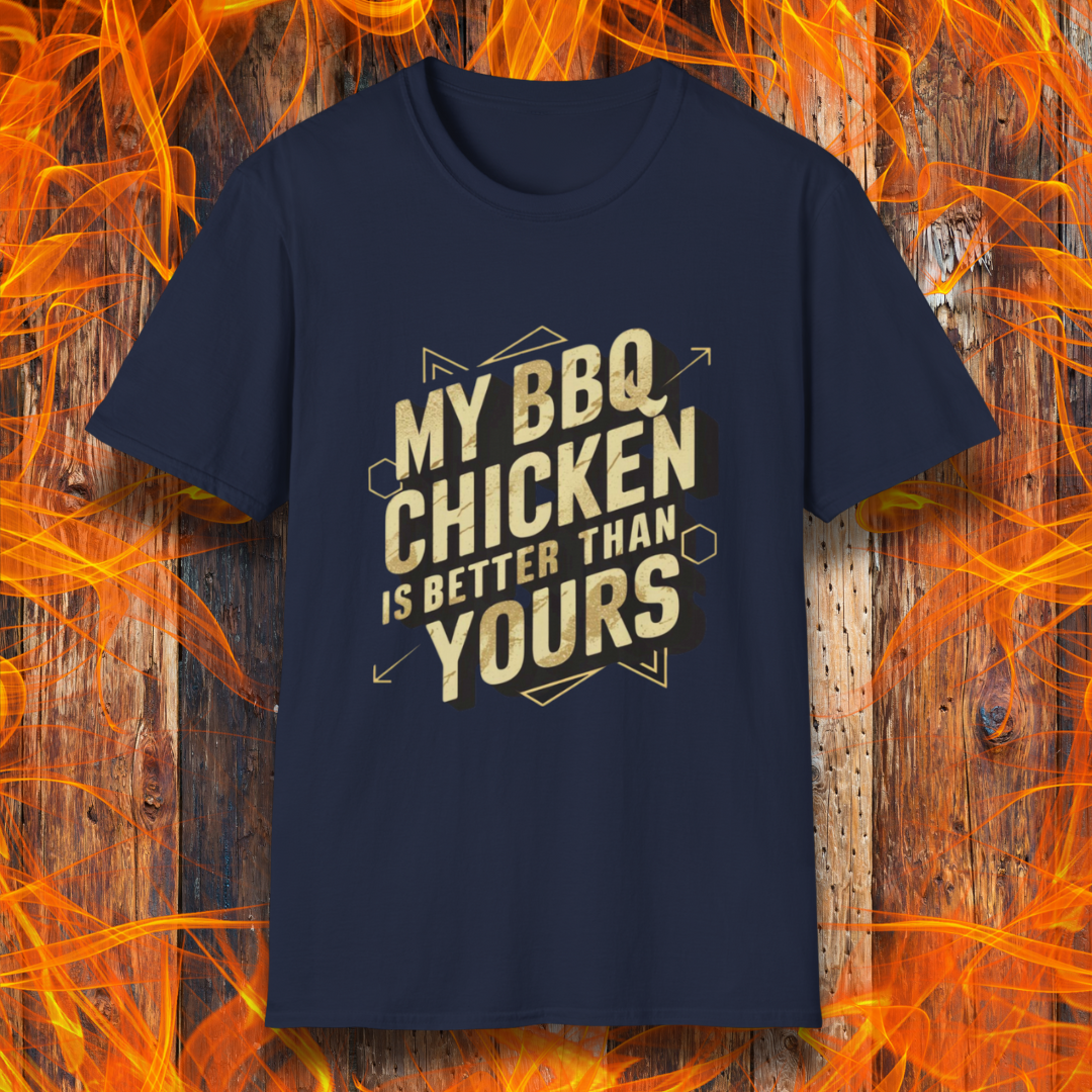 Navy T-shirt featuring a bold BBQ-themed design that reads 'MY BBQ CHICKEN IS BETTER THAN YOURS' in gold and black block lettering with geometric accents. A great choice for grill masters who take pride in their perfectly smoked and seasoned chicken.