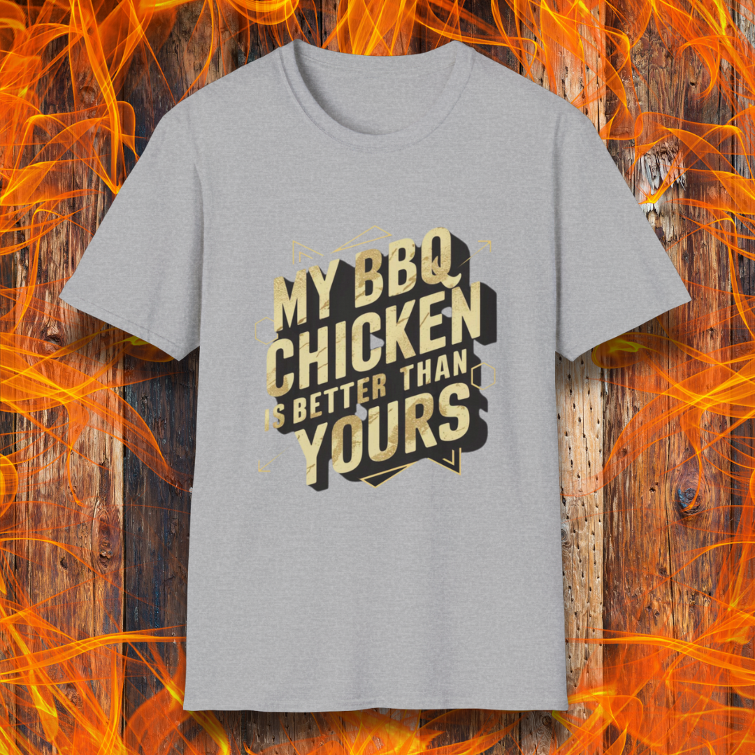 Sport Grey T-shirt featuring a bold BBQ-themed design that reads 'MY BBQ CHICKEN IS BETTER THAN YOURS' in gold and black block lettering with geometric accents. A great choice for grill masters who take pride in their perfectly smoked and seasoned chicken.