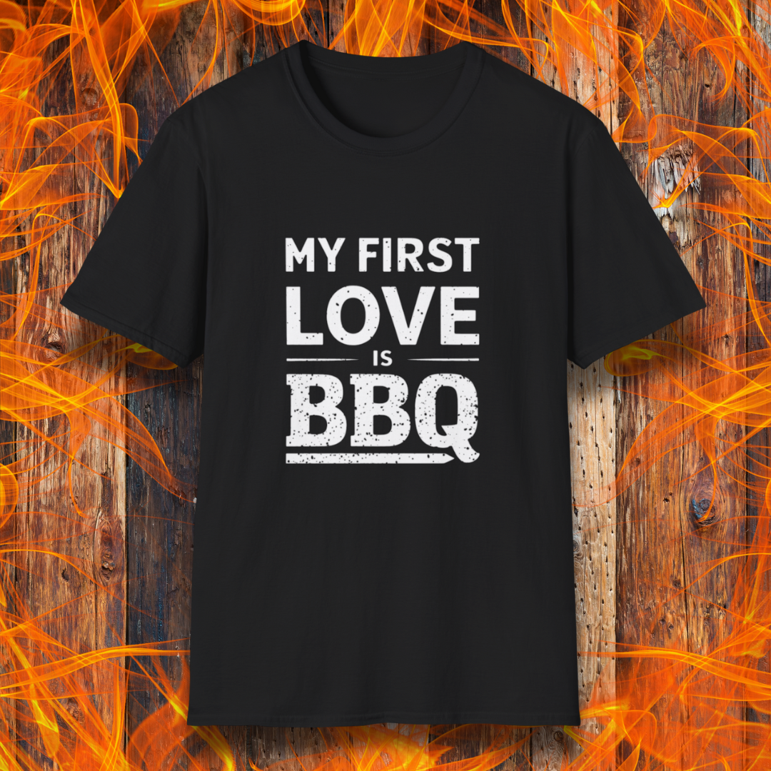 Black T-shirt with 'My First Love Is BBQ' in bold, distressed white lettering. A must-have for BBQ enthusiasts who wear their passion on their sleeve—literally!
