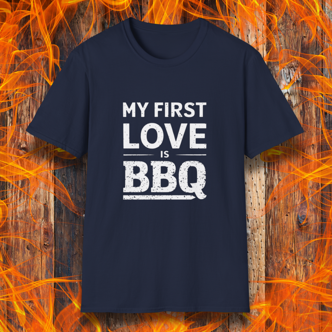 Navy T-shirt with 'My First Love Is BBQ' in bold, distressed white lettering. A must-have for BBQ enthusiasts who wear their passion on their sleeve—literally!