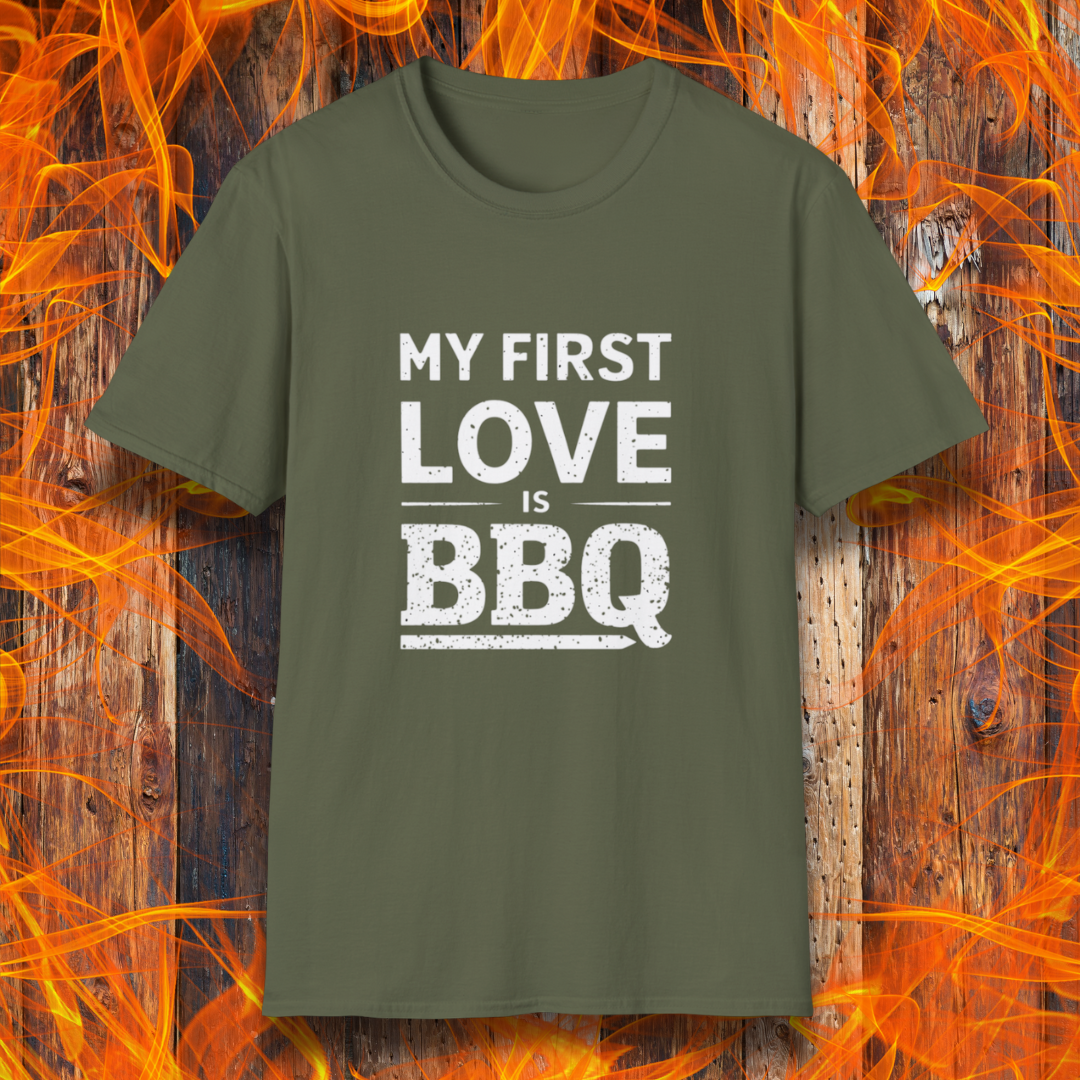 Military Green T-shirt with 'My First Love Is BBQ' in bold, distressed white lettering. A must-have for BBQ enthusiasts who wear their passion on their sleeve—literally!