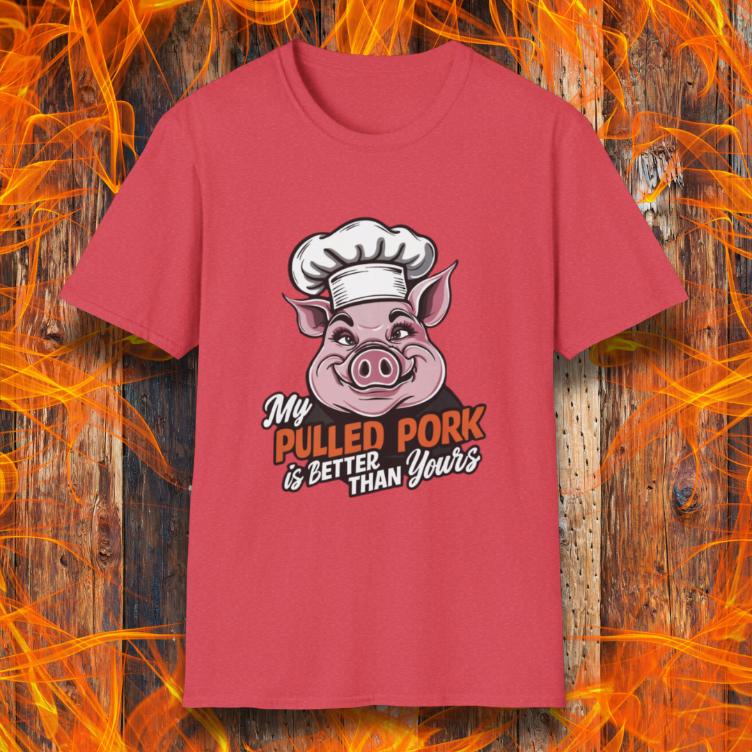 Heather Red T-shirt featuring a fun BBQ-themed design with a pink cartoon pig wearing a chef’s hat. The bold text reads 'My Pulled Pork is Better Than Yours' in a mix of white and red script and block lettering. Perfect for pitmasters who take pride in their slow-cooked pulled pork."