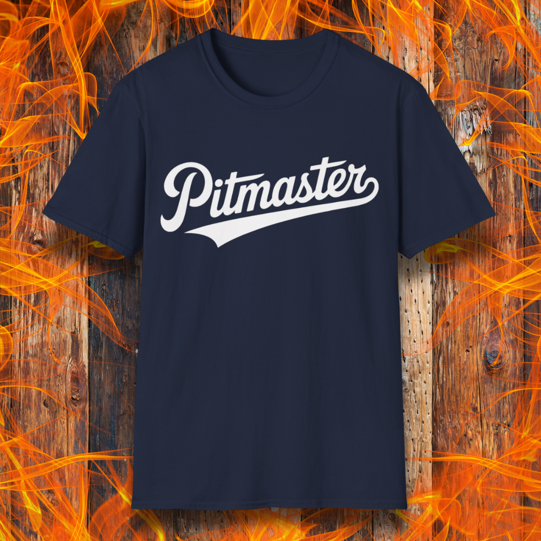 Navy blue t-shirt with 'Pitmaster' text on a wooden background with flames.