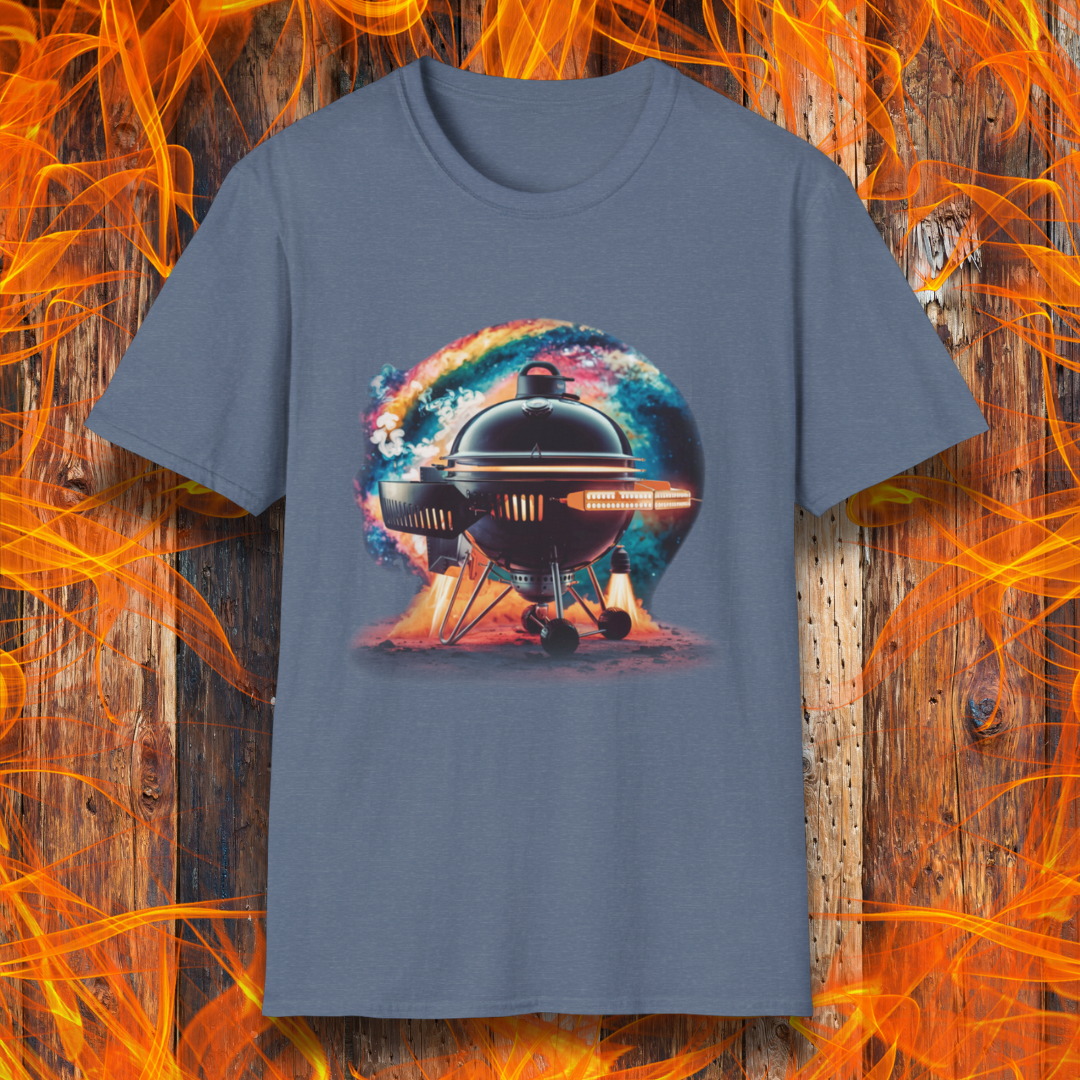 Heather Indigo T-shirt featuring a futuristic BBQ kettle grill designed like a rocket ship, with glowing thrusters, steam, and a cosmic background. A perfect design for BBQ lovers with a passion for sci-fi and grilling.