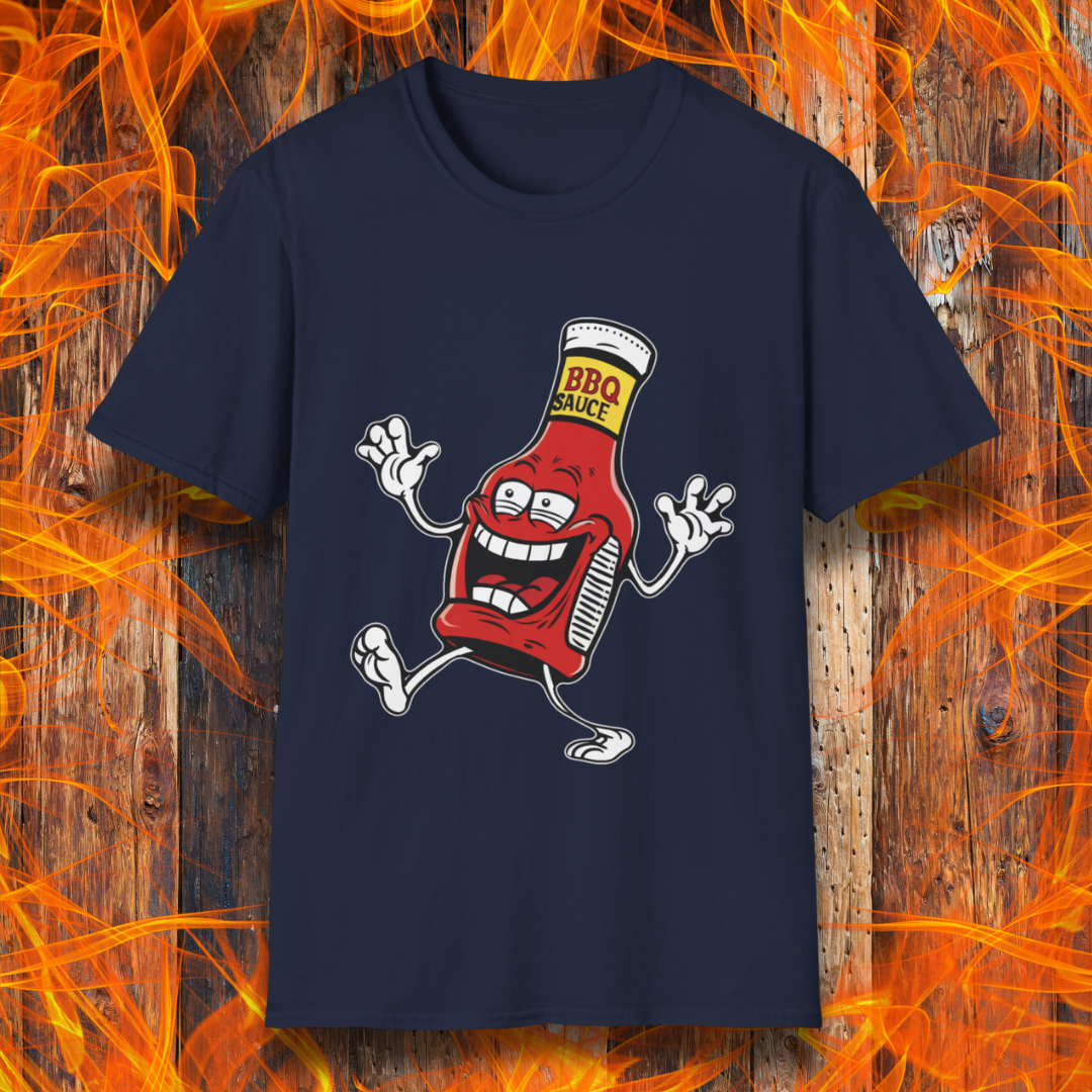 Navy T-shirt with a cartoon BBQ sauce bottle, grinning and dancing with "BBQ SAUCE" on its label. Fun, fiery design for BBQ lovers.