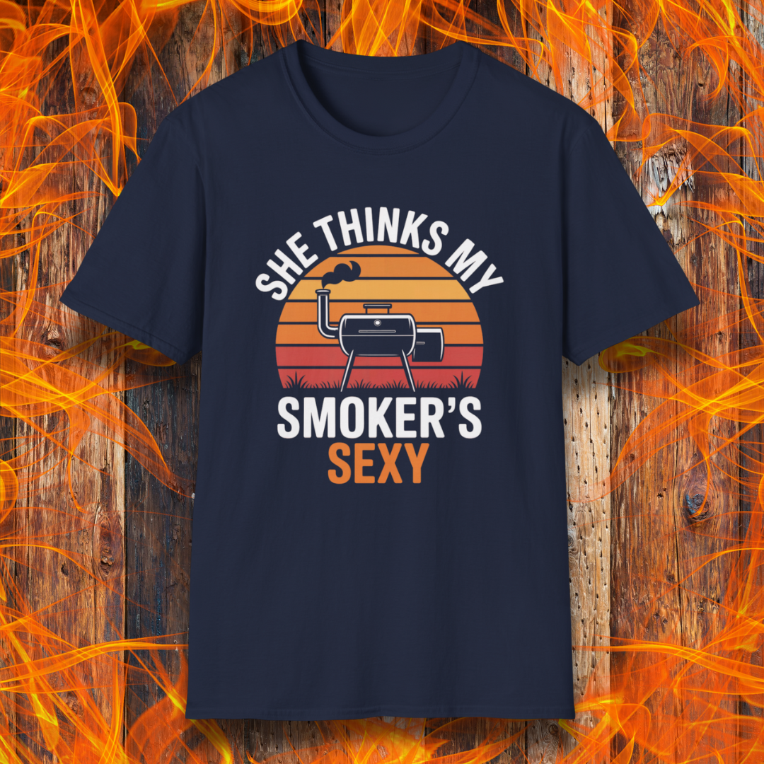 Navy blue t-shirt with graphic design and text on a wooden background with flames.