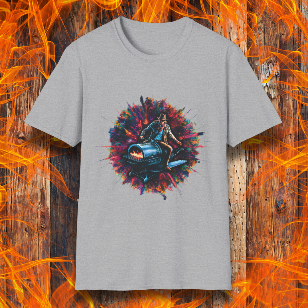 Sport Grey T-shirt featuring a striking design of a cowboy riding a futuristic, rocket-powered barbecue smoker. The artwork is set against an explosive, colorful cosmic backdrop, blending elements of Western and sci-fi themes for a bold grilling statement.