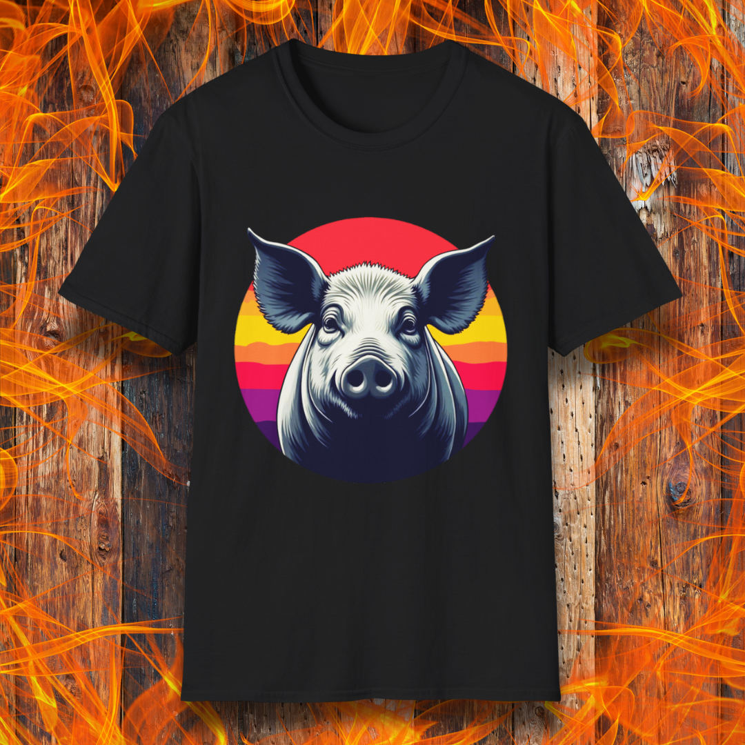 Black T-shirt featuring a striking illustration of a pig's face in a bold, high-contrast style, set against a circular sunset background with vibrant red, orange, and purple hues. The design gives a rustic yet modern feel, making it an excellent choice for BBQ lovers.