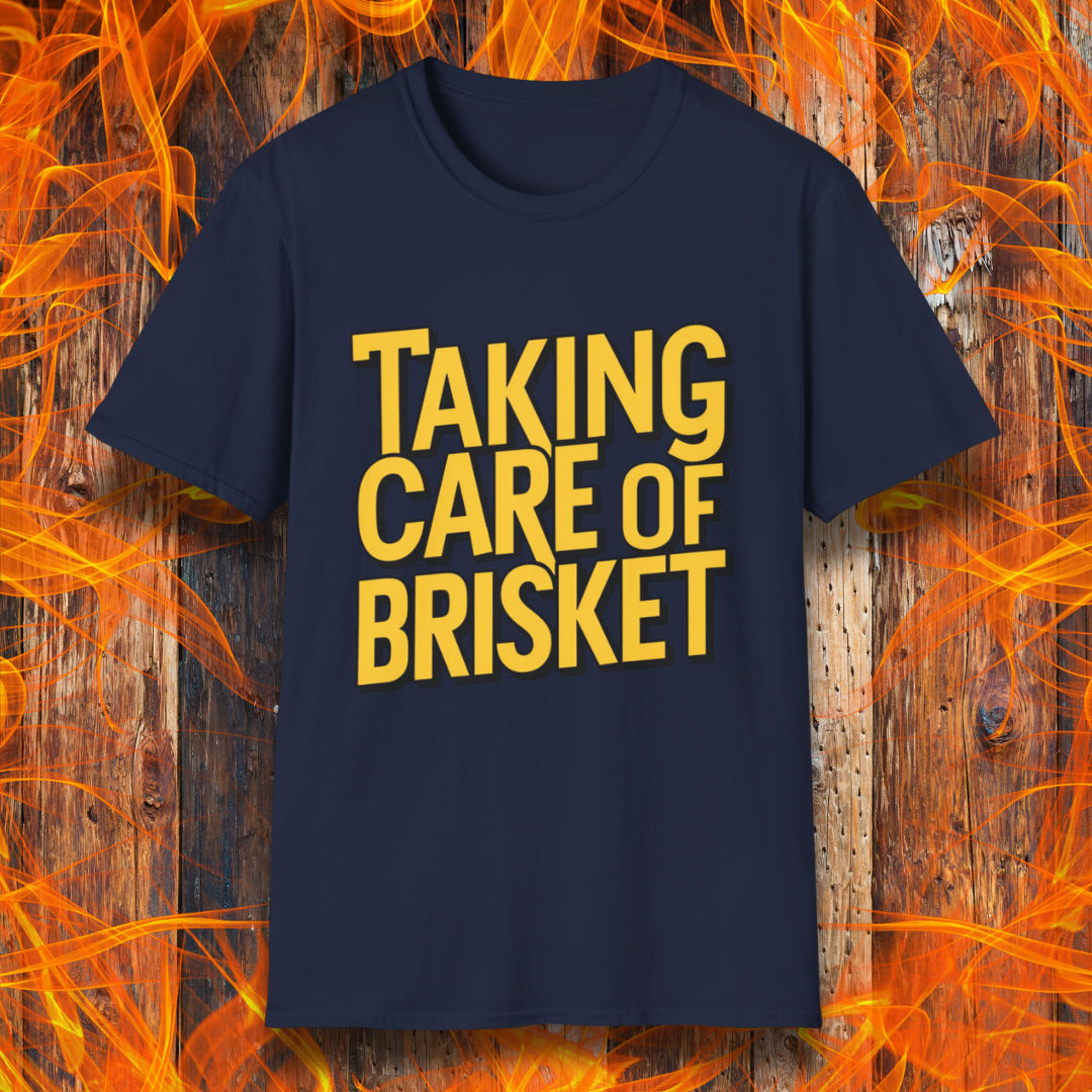 Navy T-shirt with bold yellow text reading 'Taking Care of Brisket,' a fun BBQ-themed design inspired by classic rock and grilling culture.