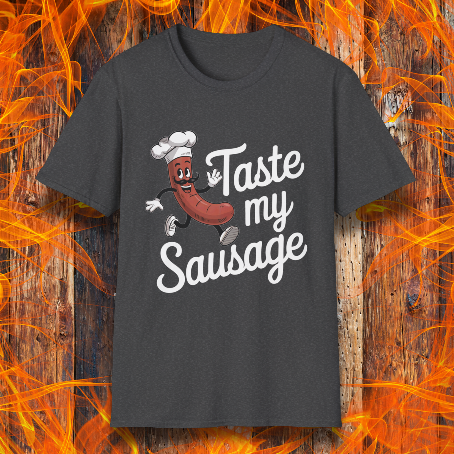 Dark Heather “Taste My Sausage” tee! Featuring a cheeky cartoon sausage in a chef hat, it’s perfect for grill masters who like their humor served hot.