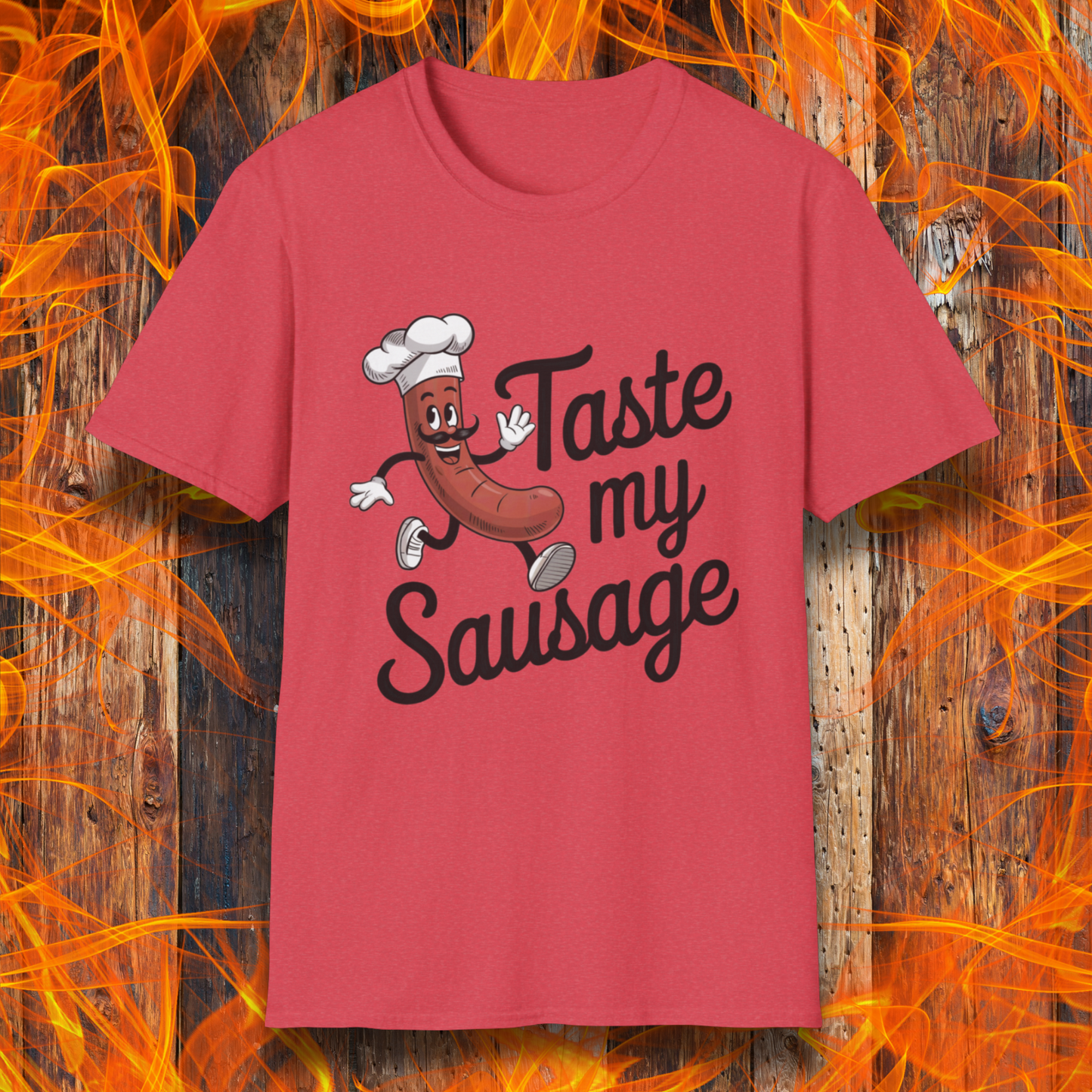 Heather Red “Taste My Sausage” tee! Featuring a cheeky cartoon sausage in a chef hat, it’s perfect for grill masters who like their humor served hot.