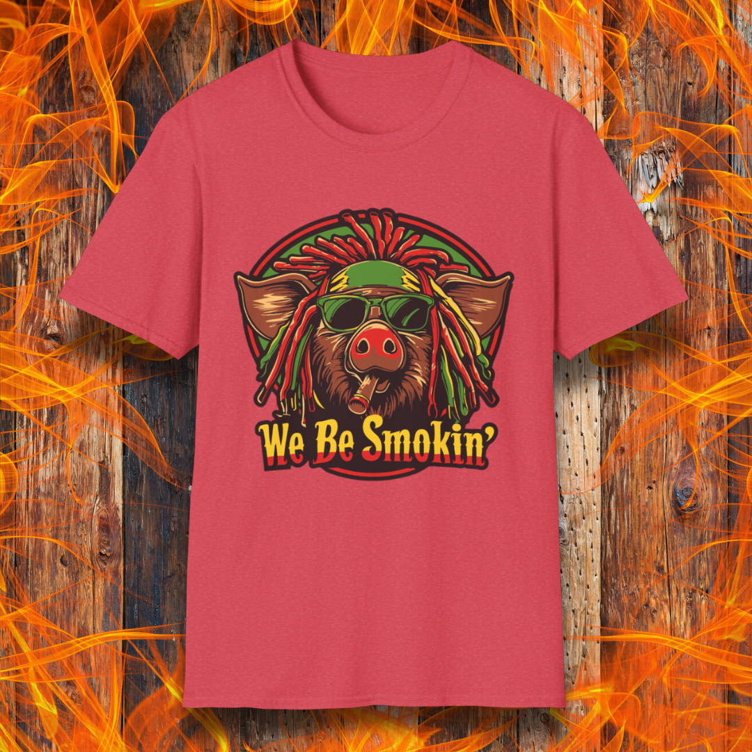 Heather Red T-shirt featuring a cool, reggae-inspired pig with dreadlocks, sunglasses, and a cigar, with the phrase 'We Be Smokin’' in bold, fiery lettering. A must-have for BBQ lovers who like to keep it chill while grilling!