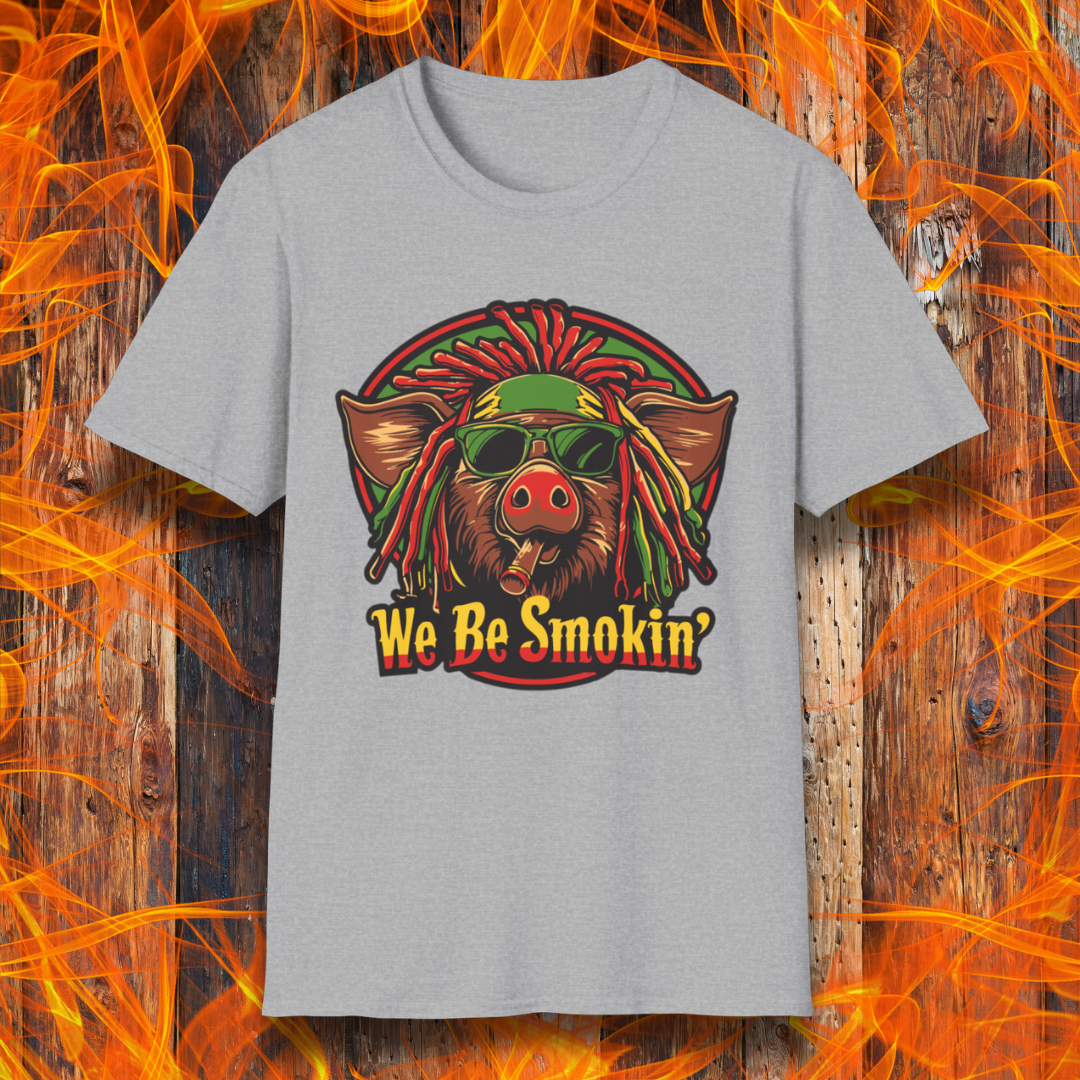 Sport Grey T-shirt featuring a cool, reggae-inspired pig with dreadlocks, sunglasses, and a cigar, with the phrase 'We Be Smokin’' in bold, fiery lettering. A must-have for BBQ lovers who like to keep it chill while grilling!