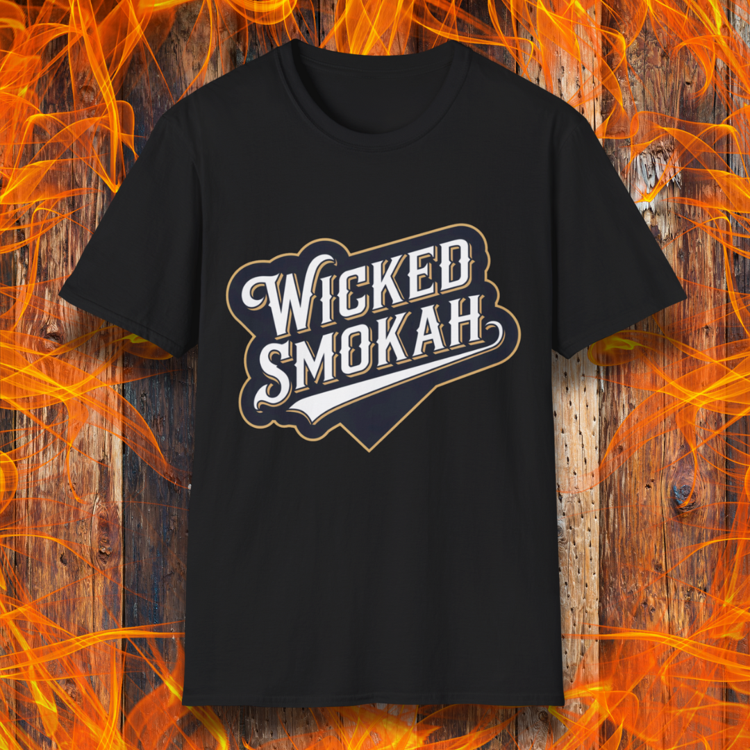 Black T-shirt featuring a bold, vintage-style design that reads "Wicked Smokah" in stylized typography, resembling a sports team logo. The lettering has a mix of white and gold outlines, giving it a classic and rugged look. The shirt is displayed against a fiery wooden background, reinforcing the smoky BBQ theme.