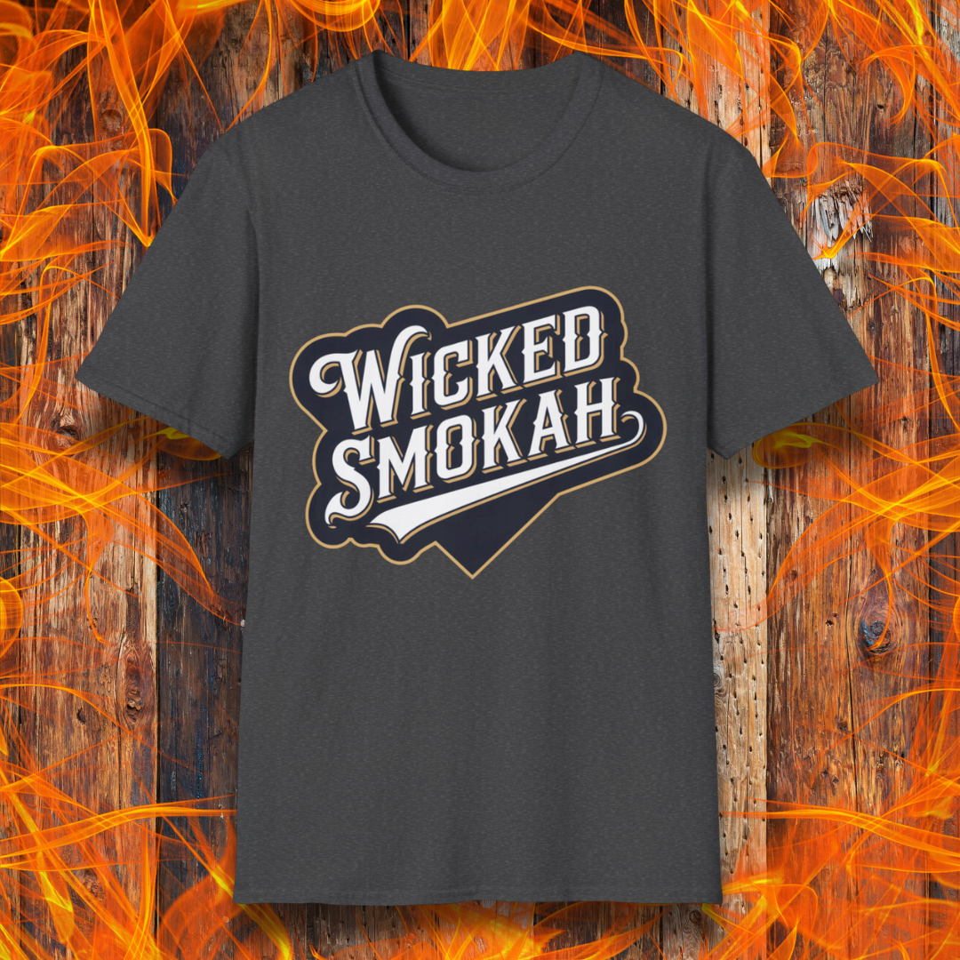 Dark Heather T-shirt featuring a bold, vintage-style design that reads "Wicked Smokah" in stylized typography, resembling a sports team logo. The lettering has a mix of white and gold outlines, giving it a classic and rugged look. The shirt is displayed against a fiery wooden background, reinforcing the smoky BBQ theme.