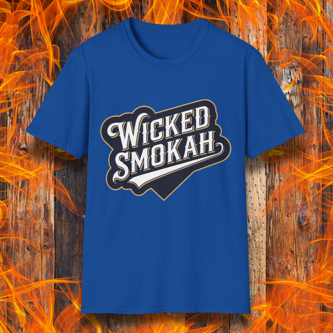 Royal Blue T-shirt featuring a bold, vintage-style design that reads "Wicked Smokah" in stylized typography, resembling a sports team logo. The lettering has a mix of white and gold outlines, giving it a classic and rugged look. The shirt is displayed against a fiery wooden background, reinforcing the smoky BBQ theme.