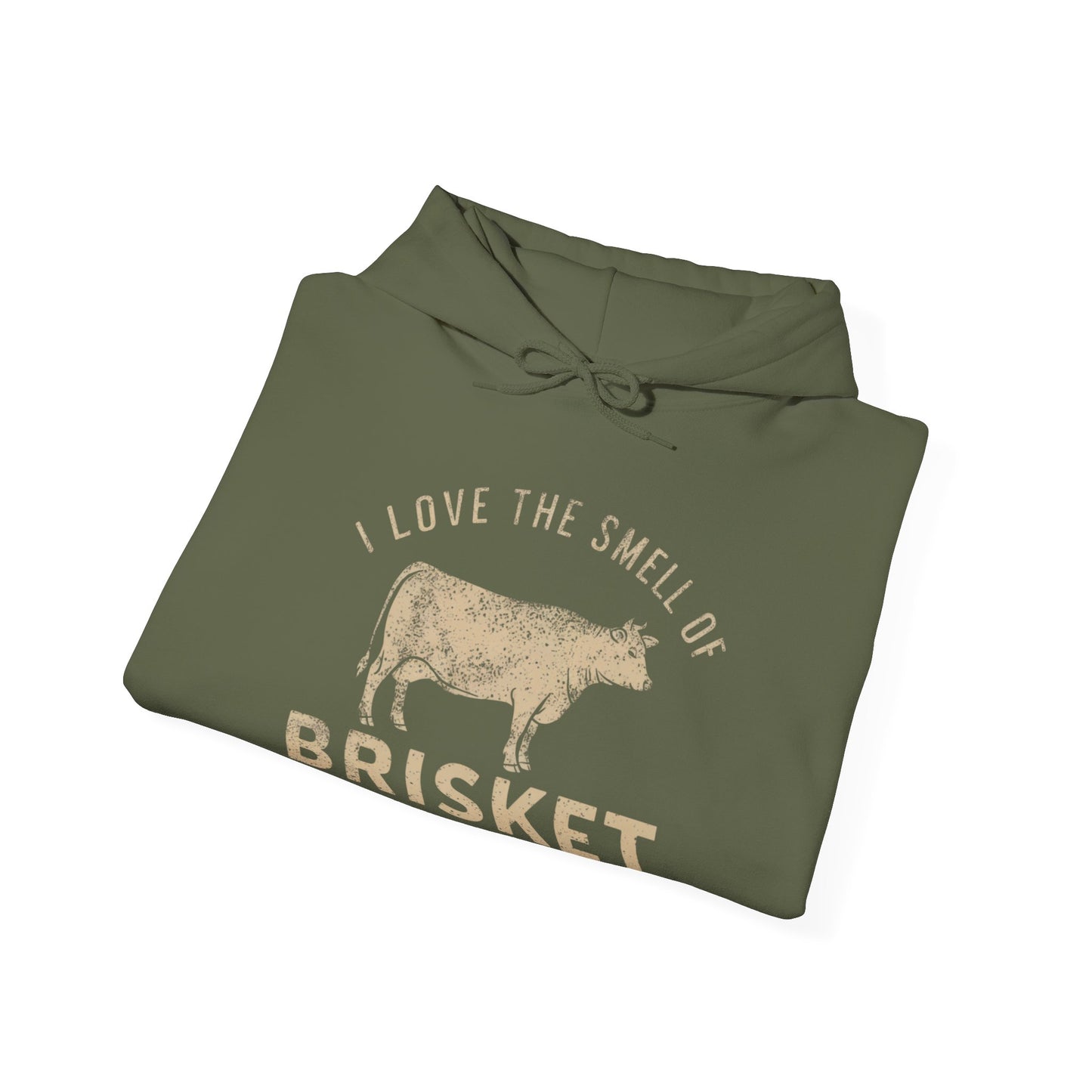 Folded green hoodie with text "I love the smell of Brisket in the morning" and cow graphic on a white background
