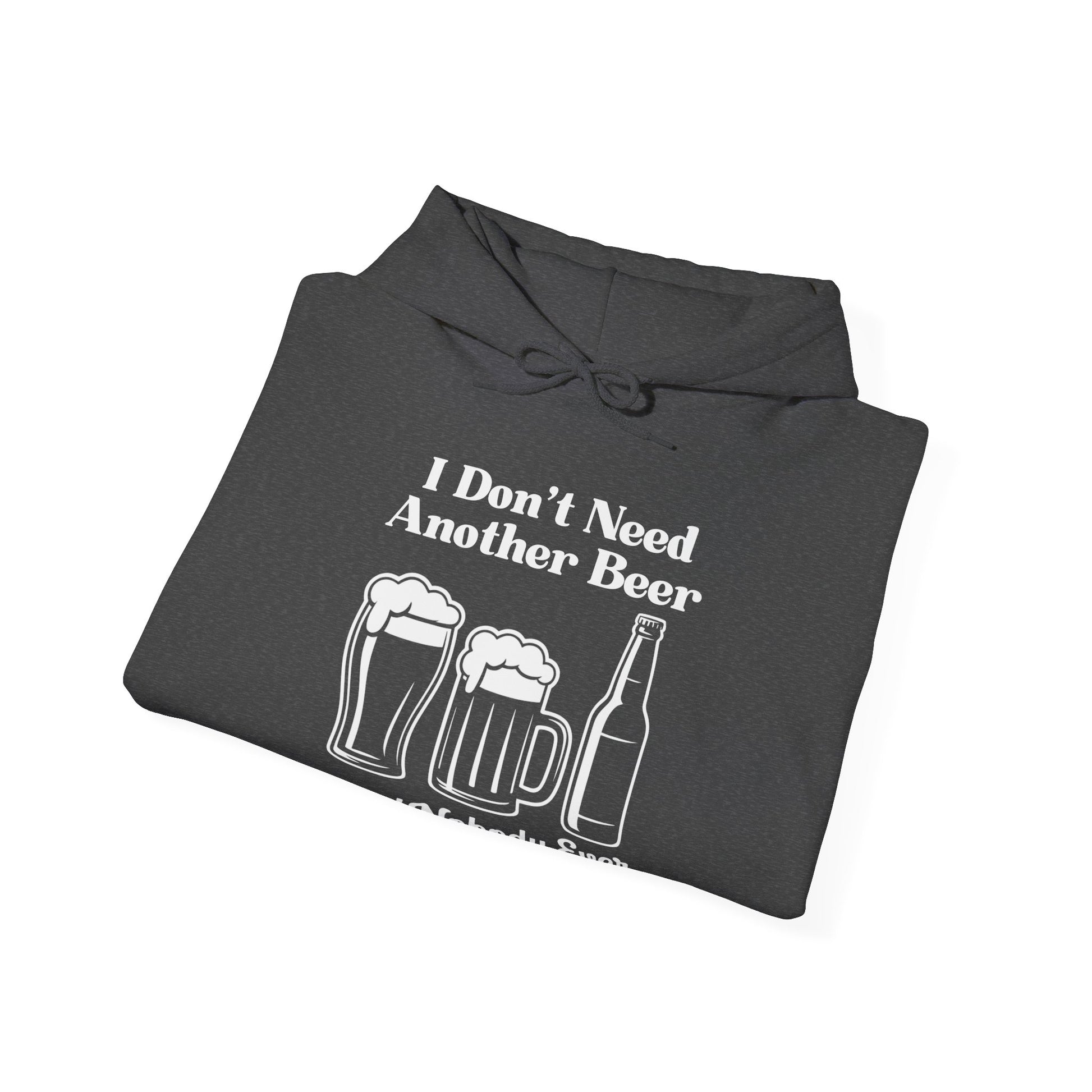 Folded dark gray hoodie with white text "I don't need another beer said nobody ever" and graphics on a white background