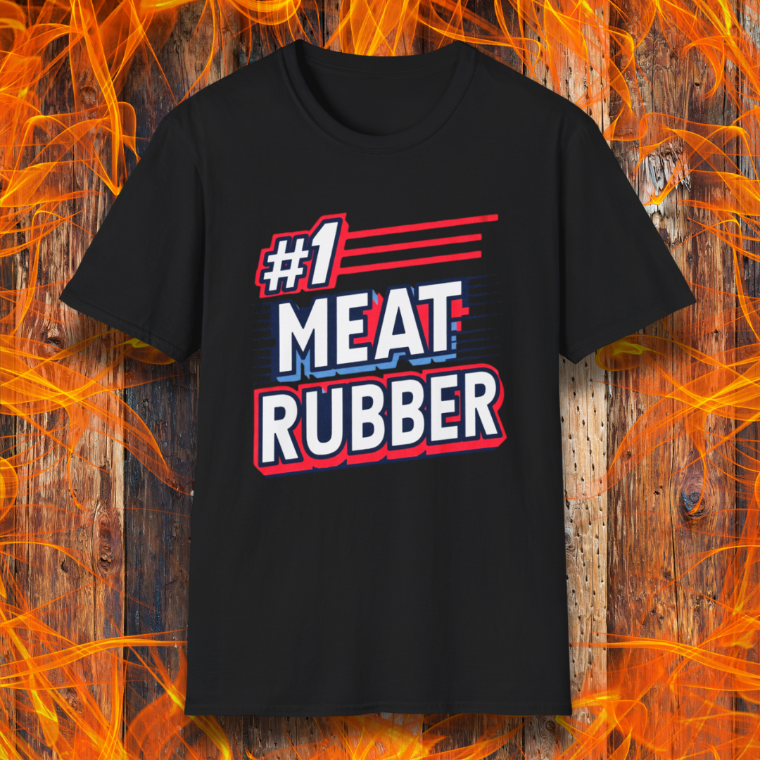 Black T-shirt featuring a bold and humorous BBQ-themed design that reads '#1 MEAT RUBBER' in white and navy block lettering with red and blue speed-line accents. Perfect for grill masters and barbecue lovers with a sense of humor.