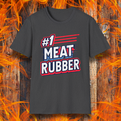 Dark Heather T-shirt featuring a bold and humorous BBQ-themed design that reads '#1 MEAT RUBBER' in white and navy block lettering with red and blue speed-line accents. Perfect for grill masters and barbecue lovers with a sense of humor.