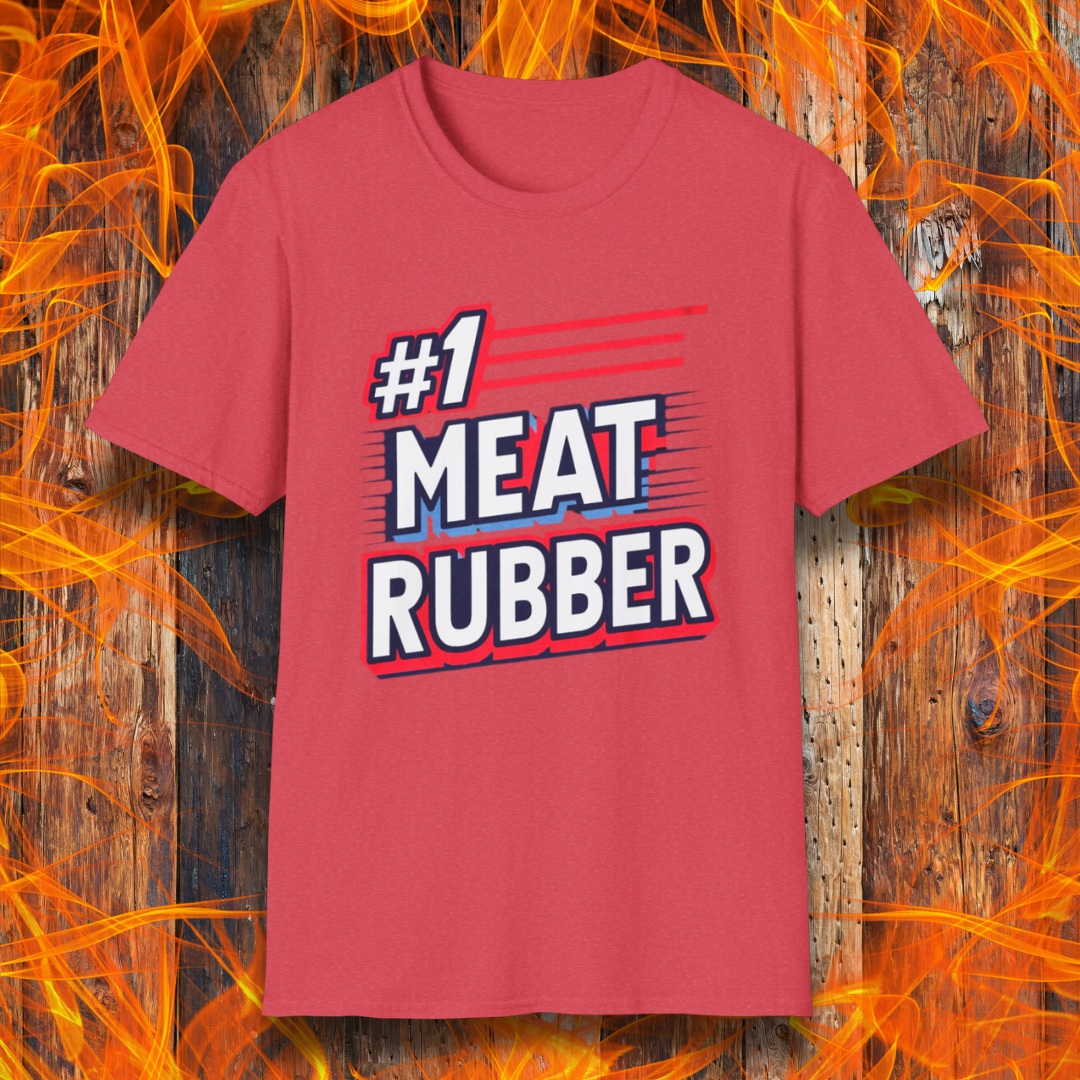Heather Red T-shirt featuring a bold and humorous BBQ-themed design that reads '#1 MEAT RUBBER' in white and navy block lettering with red and blue speed-line accents. Perfect for grill masters and barbecue lovers with a sense of humor.