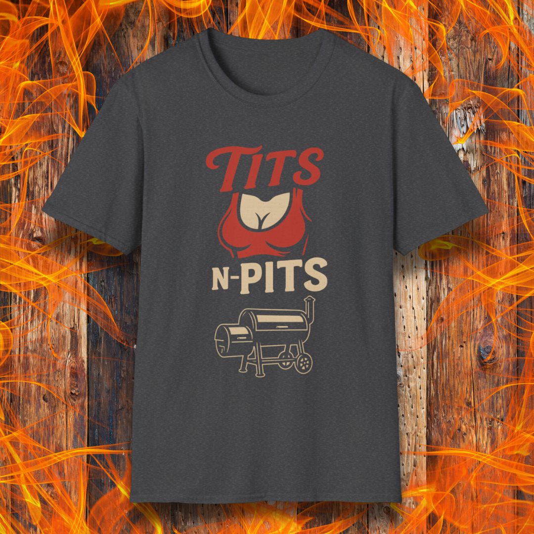 Grey t-shirt with red and white graphic design on a wooden background with flames.