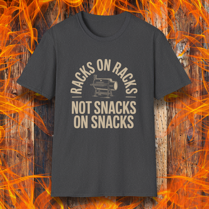 Black t-shirt with graphic and text on a wooden background with flames