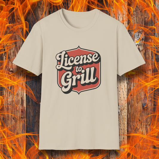 Tan t-shirt with 'License to Grill' design on a fiery background
