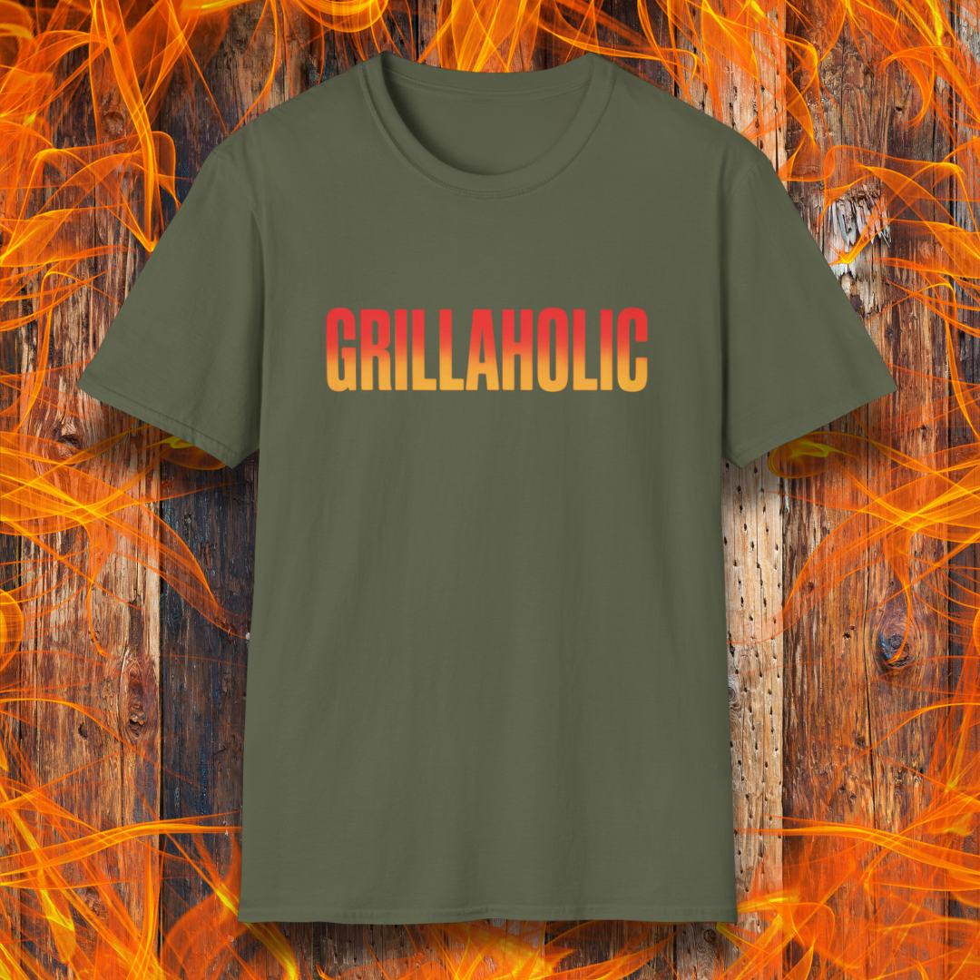 Green t-shirt with 'GRILLAHOLIC' text on a wooden background with flames.