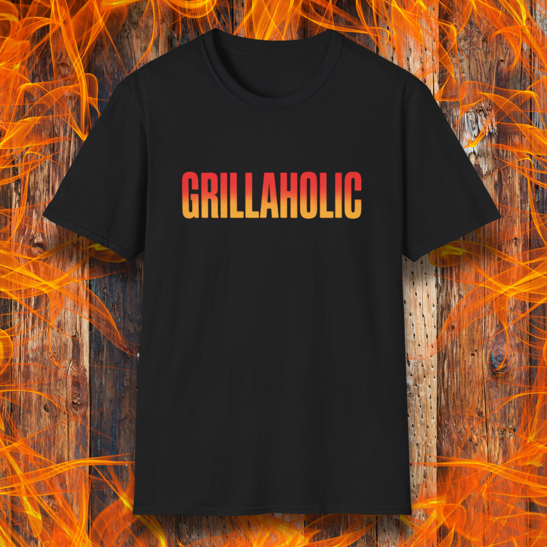 Black t-shirt with 'GRILLAHOLIC' text on a wooden background with flames.