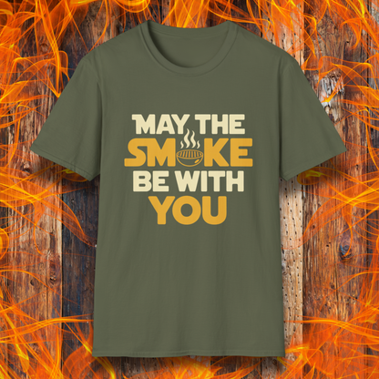 Military Green t-shirt with the phrase "May The Smoke Be With You" on a wooden fire background.