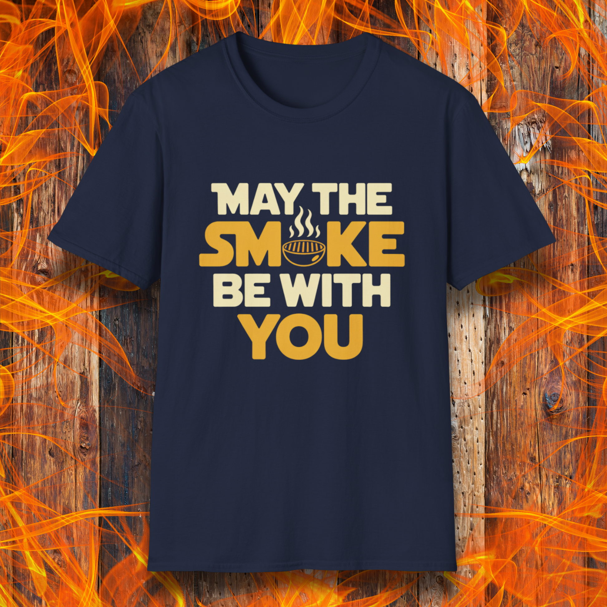 Navy t-shirt with the phrase "May The Smoke Be With You" on a wooden fire background.