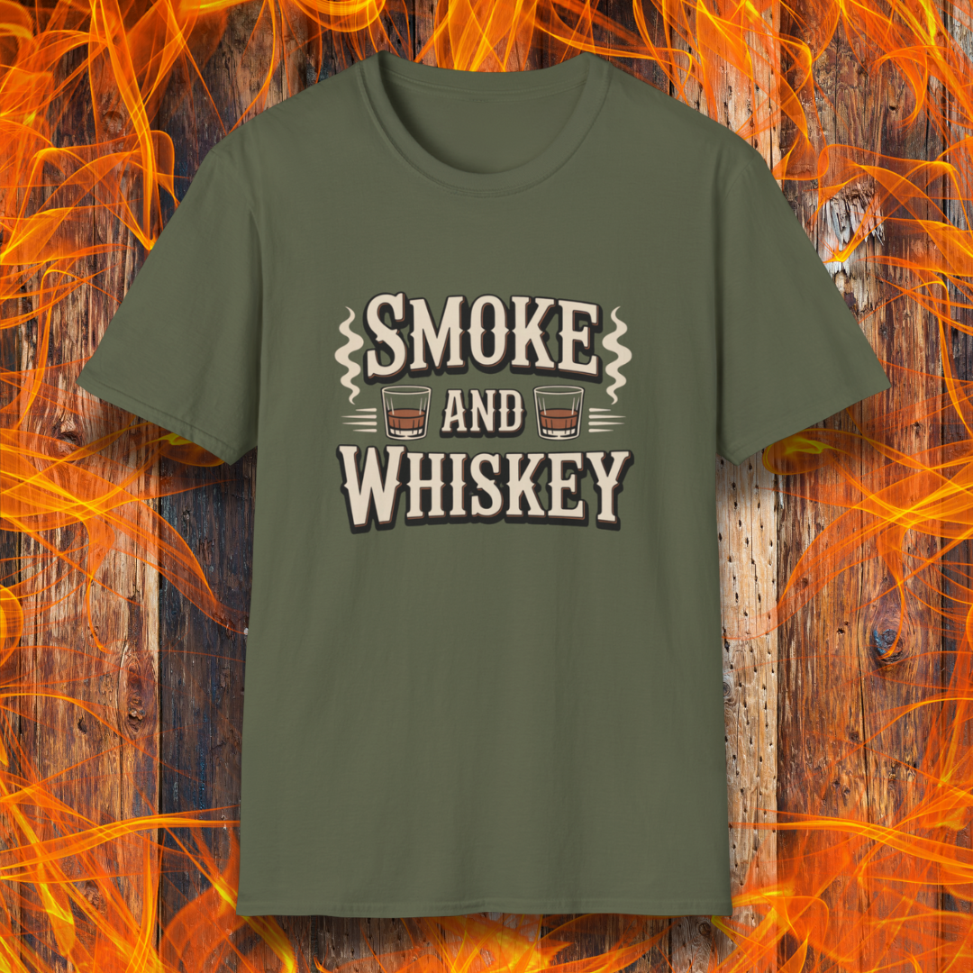 Green t-shirt with 'Smoke and Whiskey' text on a wooden background with flames.