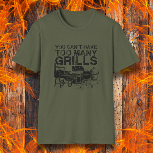 Green t-shirt with 'You can't have too many grills' text and graphic on a wooden background with flames.