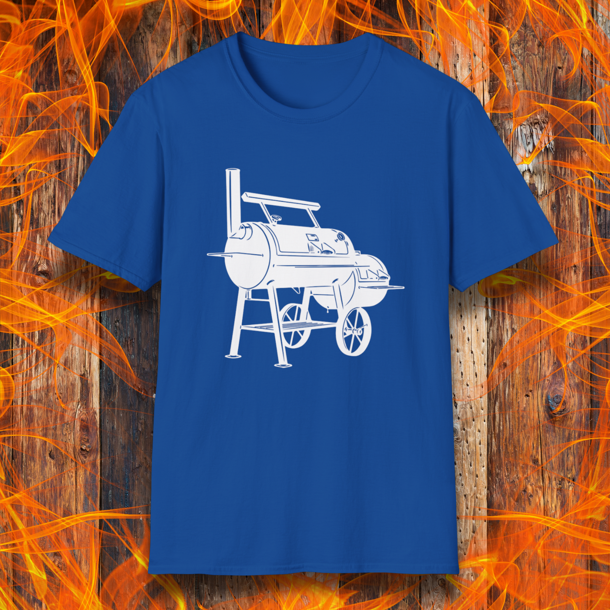 Blue t-shirt with white barbecue graphic on a wooden background with flames