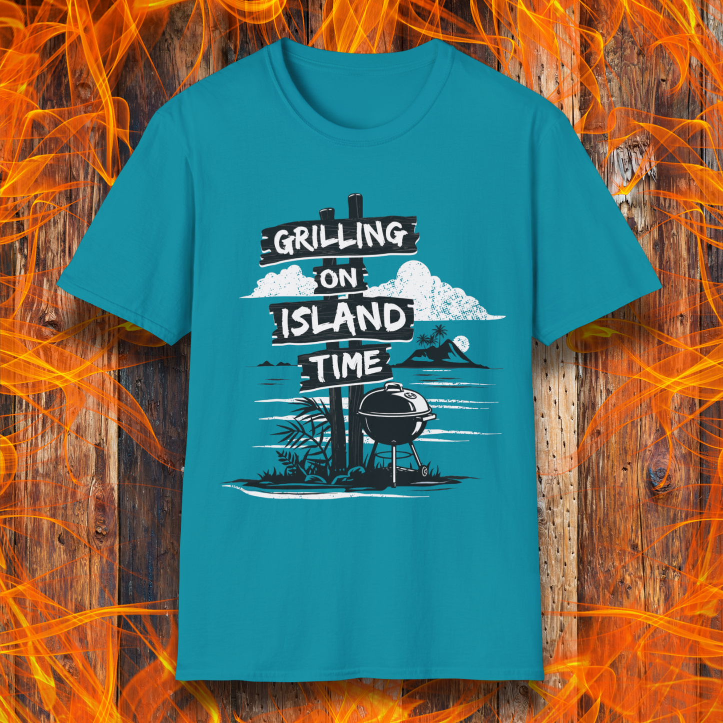 Blue t-shirt with 'Grilling on Island Time' graphic design on a wooden background with flames.