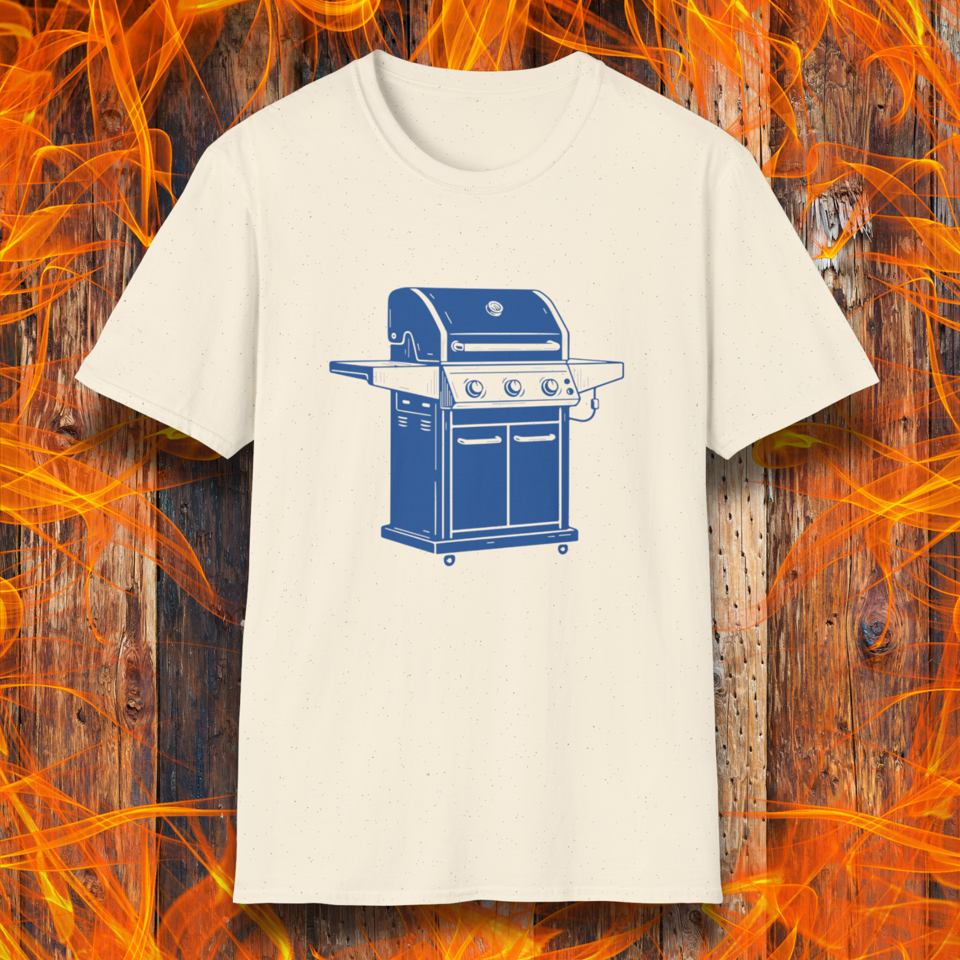 Beige t-shirt with a blue grill graphic on a wooden background with flames