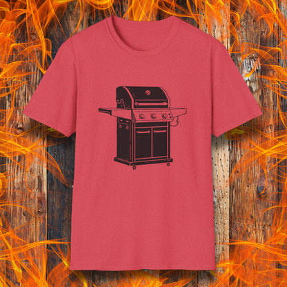 Red t-shirt with a black grill graphic on a wooden background with flames.