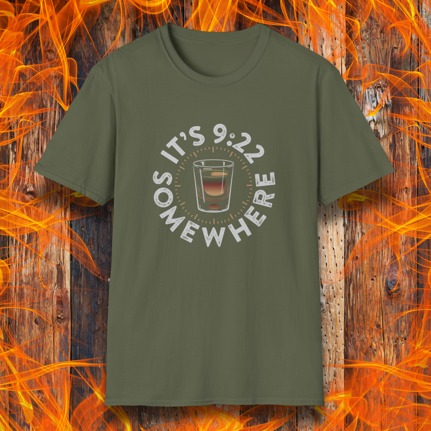 Green t-shirt with a graphic design on a wooden background with flames