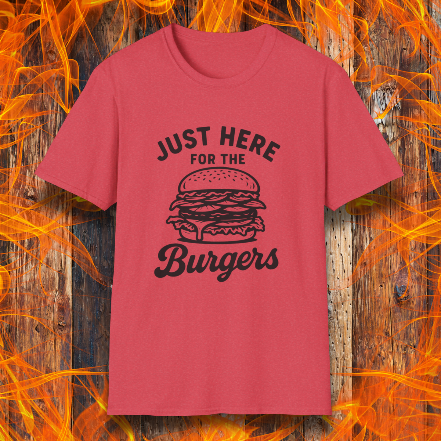 Red t-shirt with 'Just Here for the Burgers' text and graphic on a wooden background with flames.