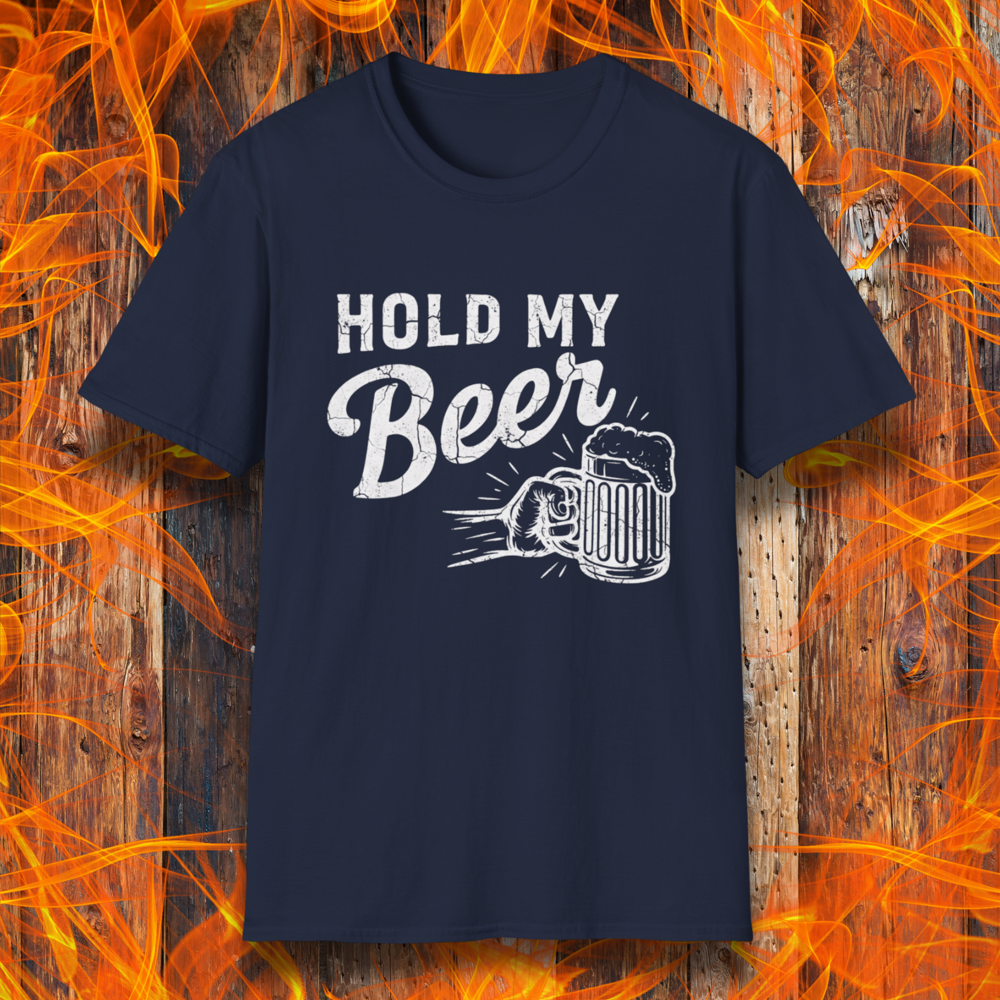 Navy blue t-shirt with 'Hold My Beer' graphic on a wooden background with flames.