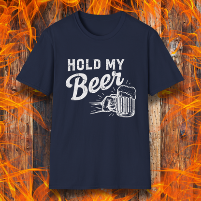 Navy blue t-shirt with 'Hold My Beer' graphic on a wooden background with flames.