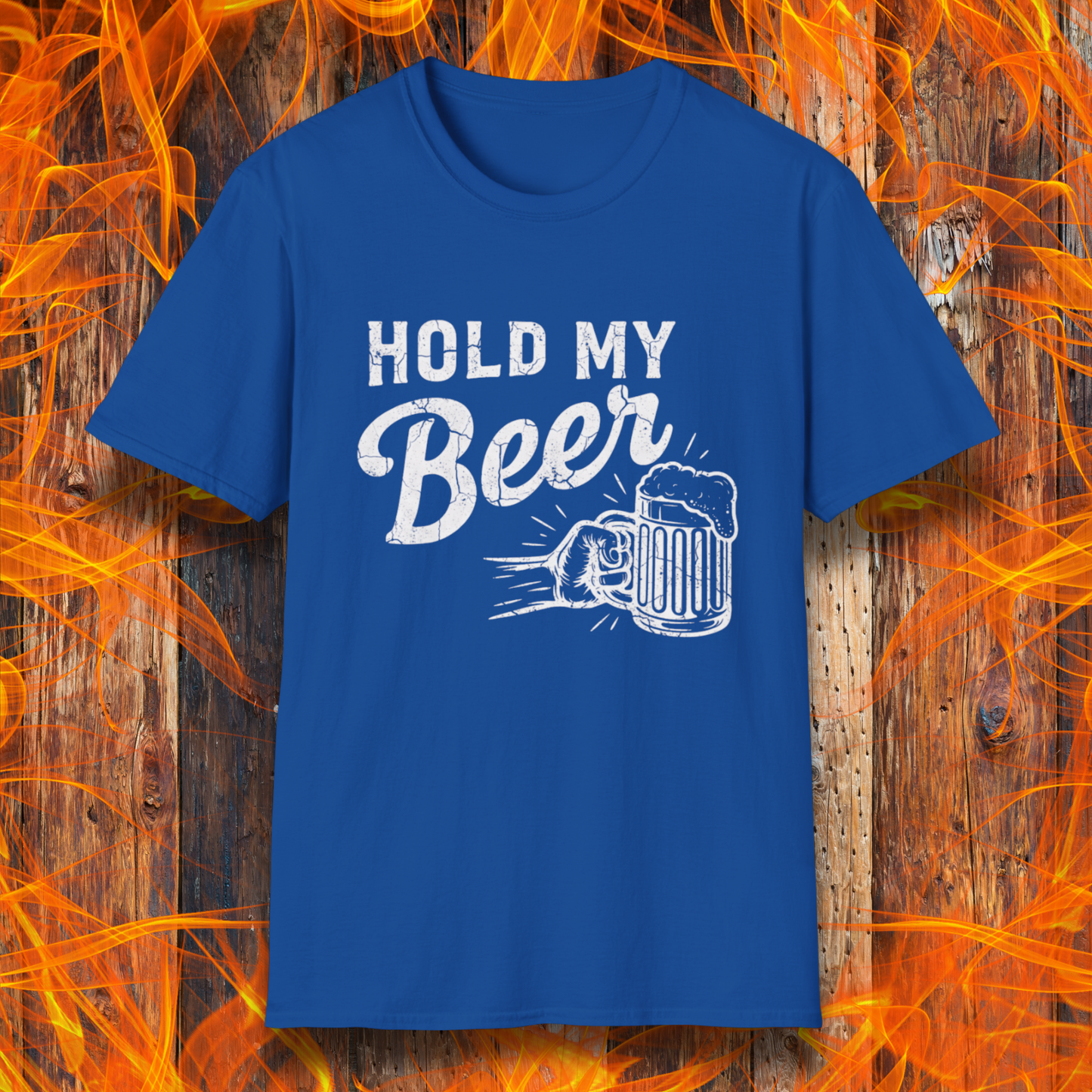 Blue t-shirt with 'Hold My Beer' text and graphic on a wooden background with flames.