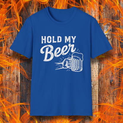 Blue t-shirt with 'Hold My Beer' text and graphic on a wooden background with flames.