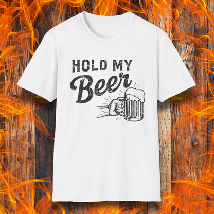 White t-shirt with 'Hold My Beer' graphic on a wooden background with flames.