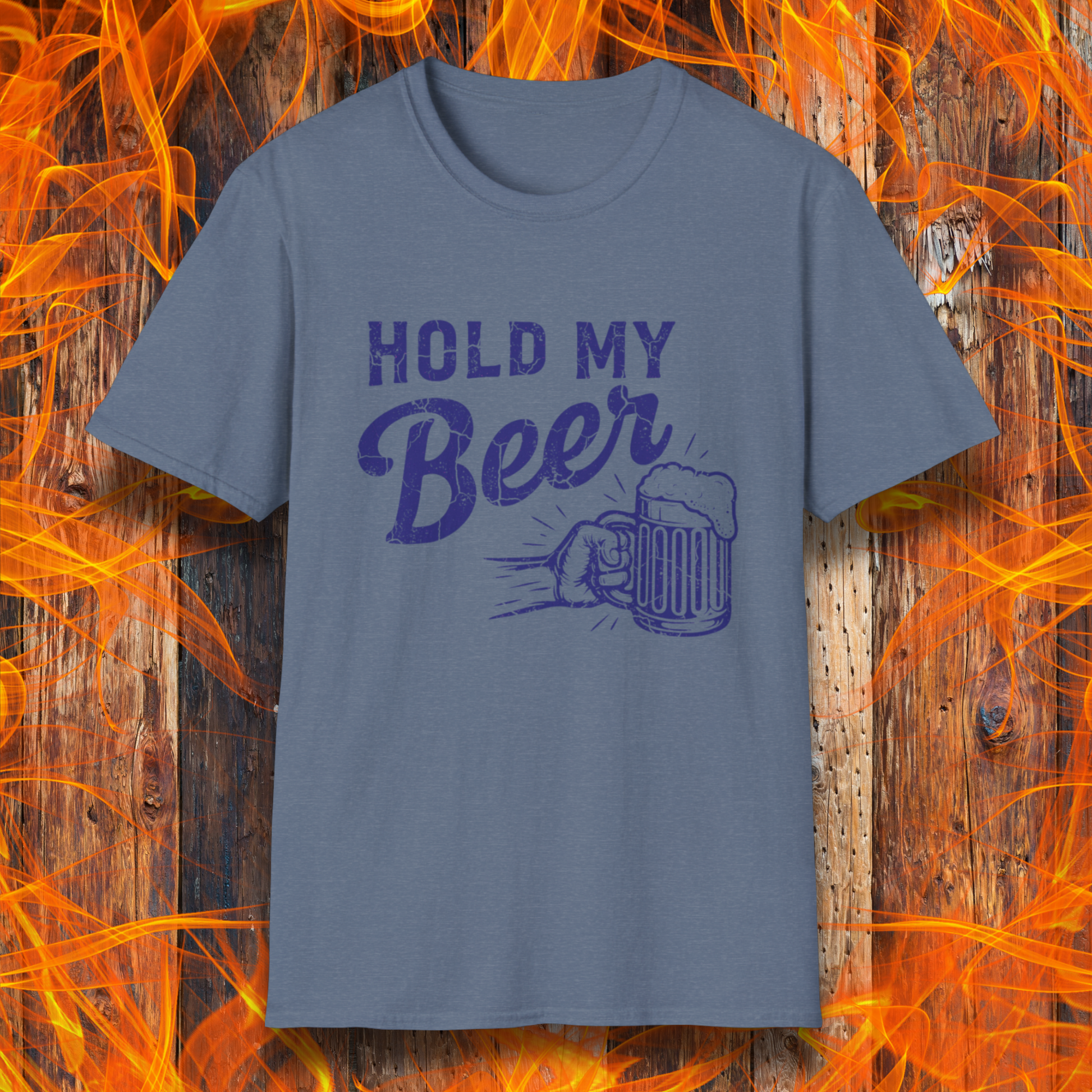 Blue t-shirt with 'Hold My Beer' graphic on a wooden background with flames.