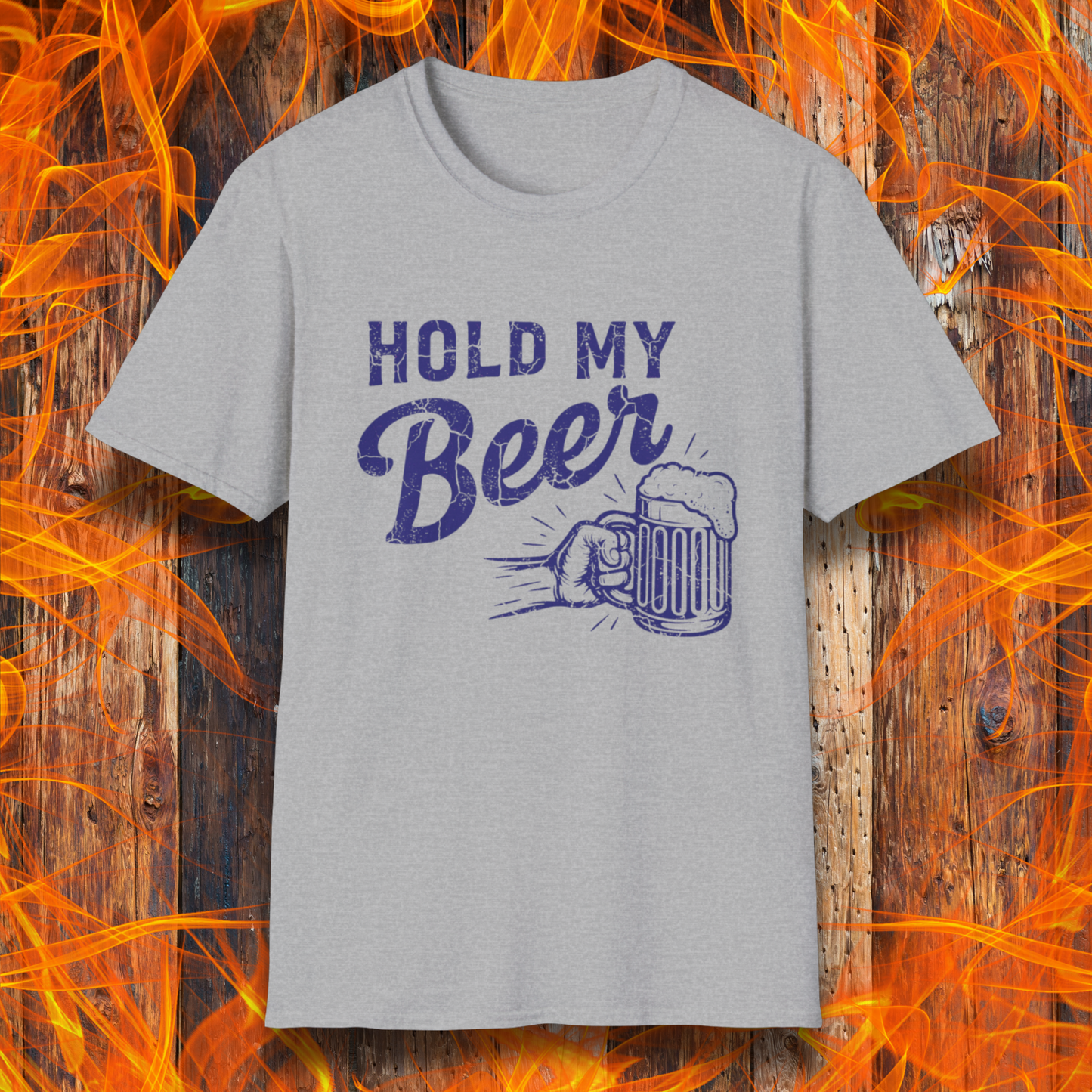 Gray t-shirt with 'Hold My Beer' design on a wooden background with flames.