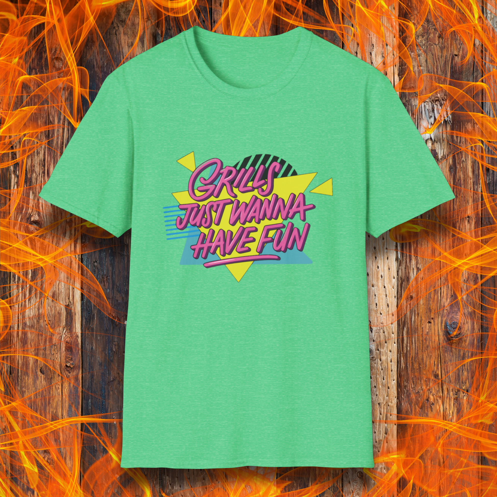 Green t-shirt with colorful text design on a wooden background with flames