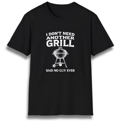 A T-shirt with the phrase "I don't need another grill, said no guy ever" with a graphic of a kettle charcoal grill.