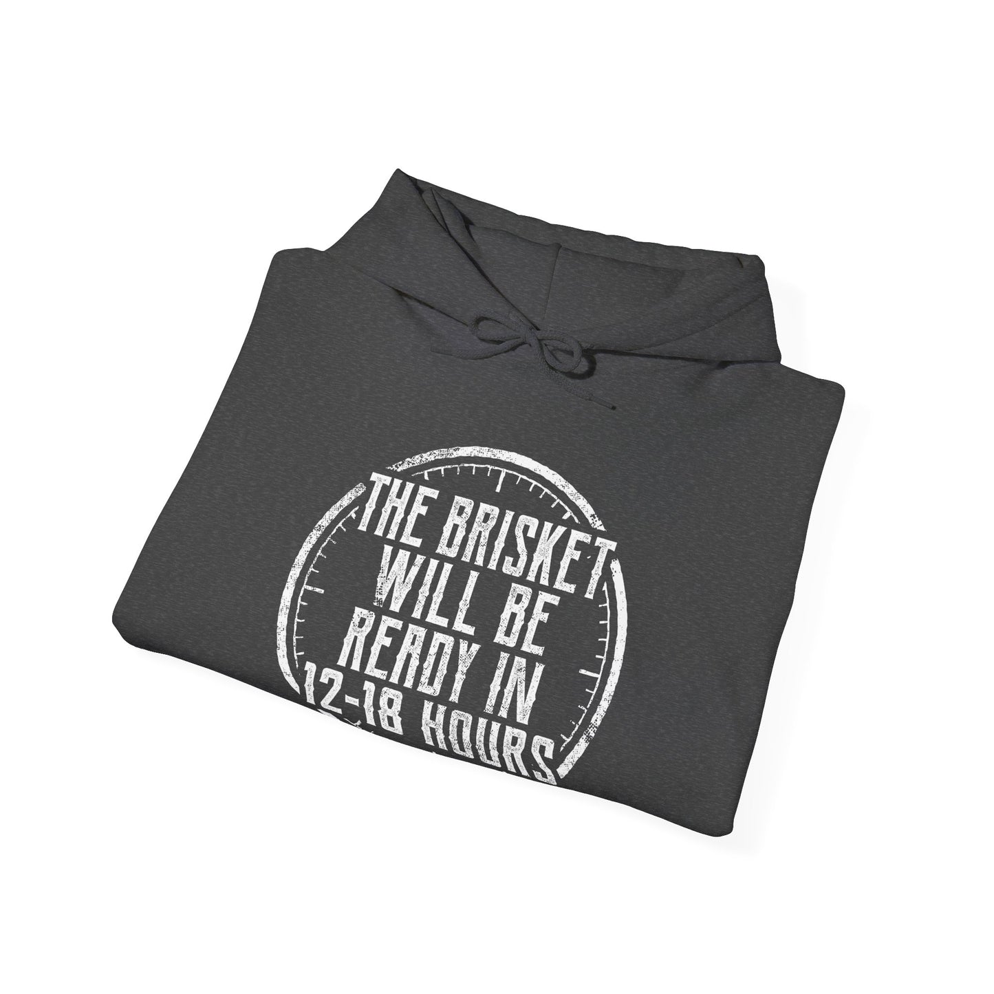 Folded gray hoodie with white text "The Brisket will be ready in 12-18 Hours" and a a click graphic on a white background